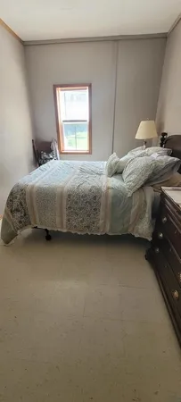 a living room with furniture dining table and wooden floor