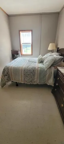 a living room with furniture dining table and wooden floor