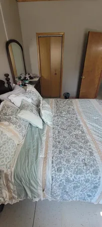 a view of field with trees in the background