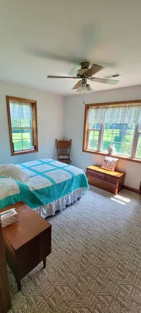a room with pool table and a large window