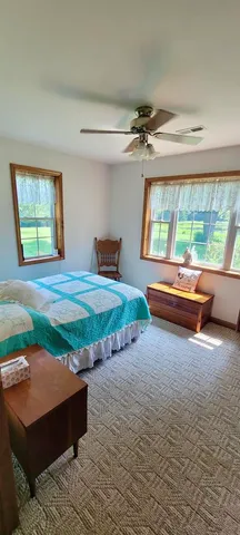 a room with pool table and a large window