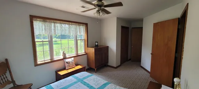 a bathroom with a sink a toilet a tub and shower