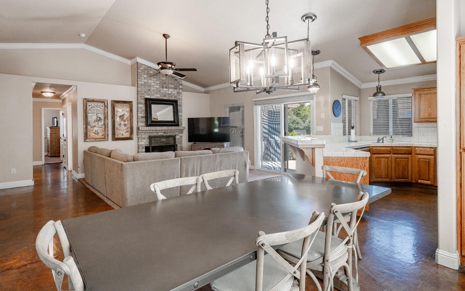 2232 Howard Street Kingsburg, CA 93631 - Photo 4 of 20 a dining room with furniture a chandelier and wooden floor