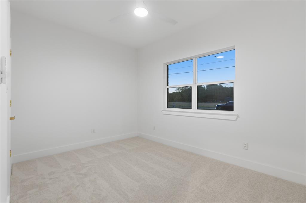 130 Cedar Elm Road Trinidad, TX 75163 - Photo 21 of 27 Neutral-toned carpet flooring complements the white walls and trim