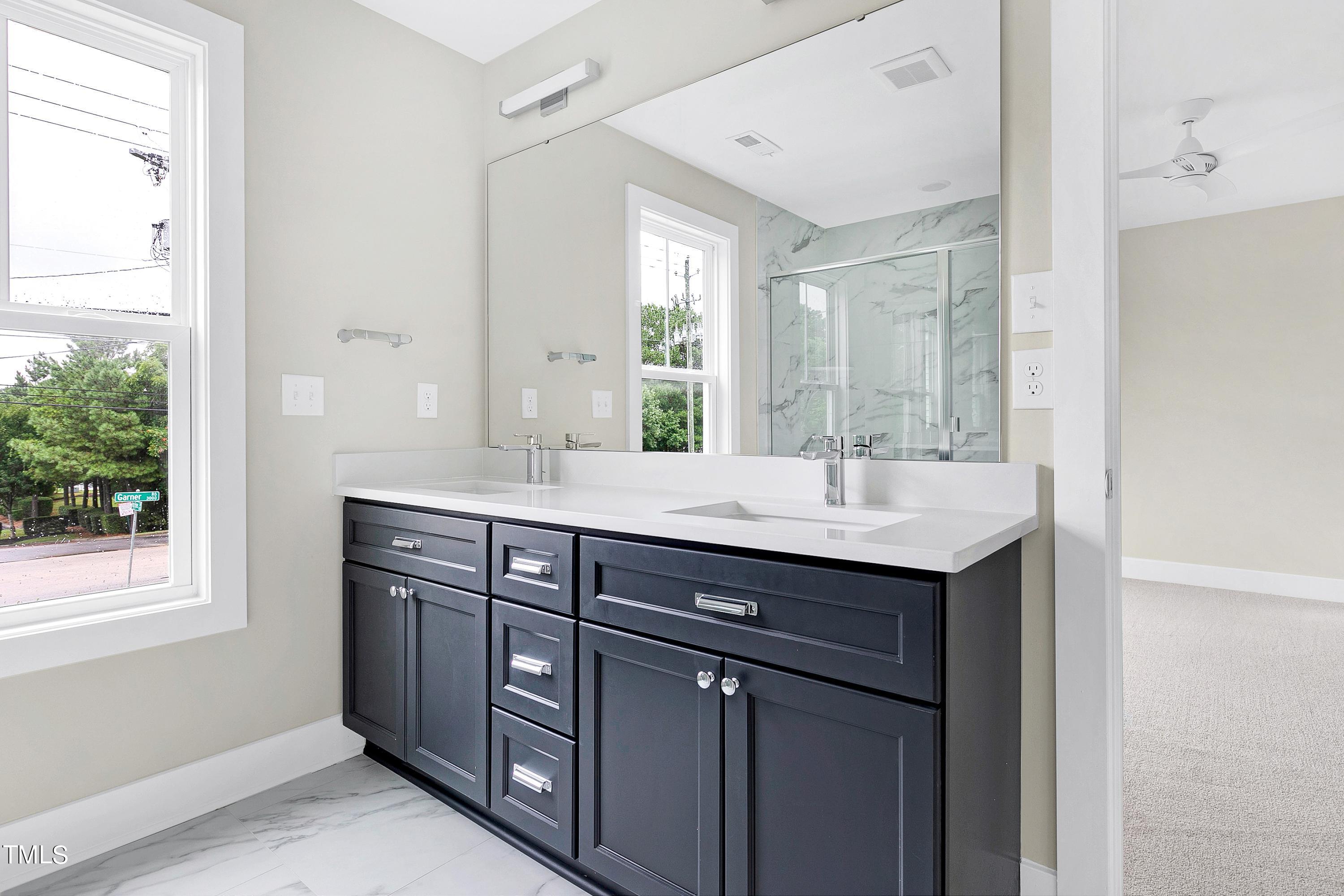 3014 Garner Road Raleigh, NC 27610 - Photo 25 of 39 a bathroom with a sink and a mirror