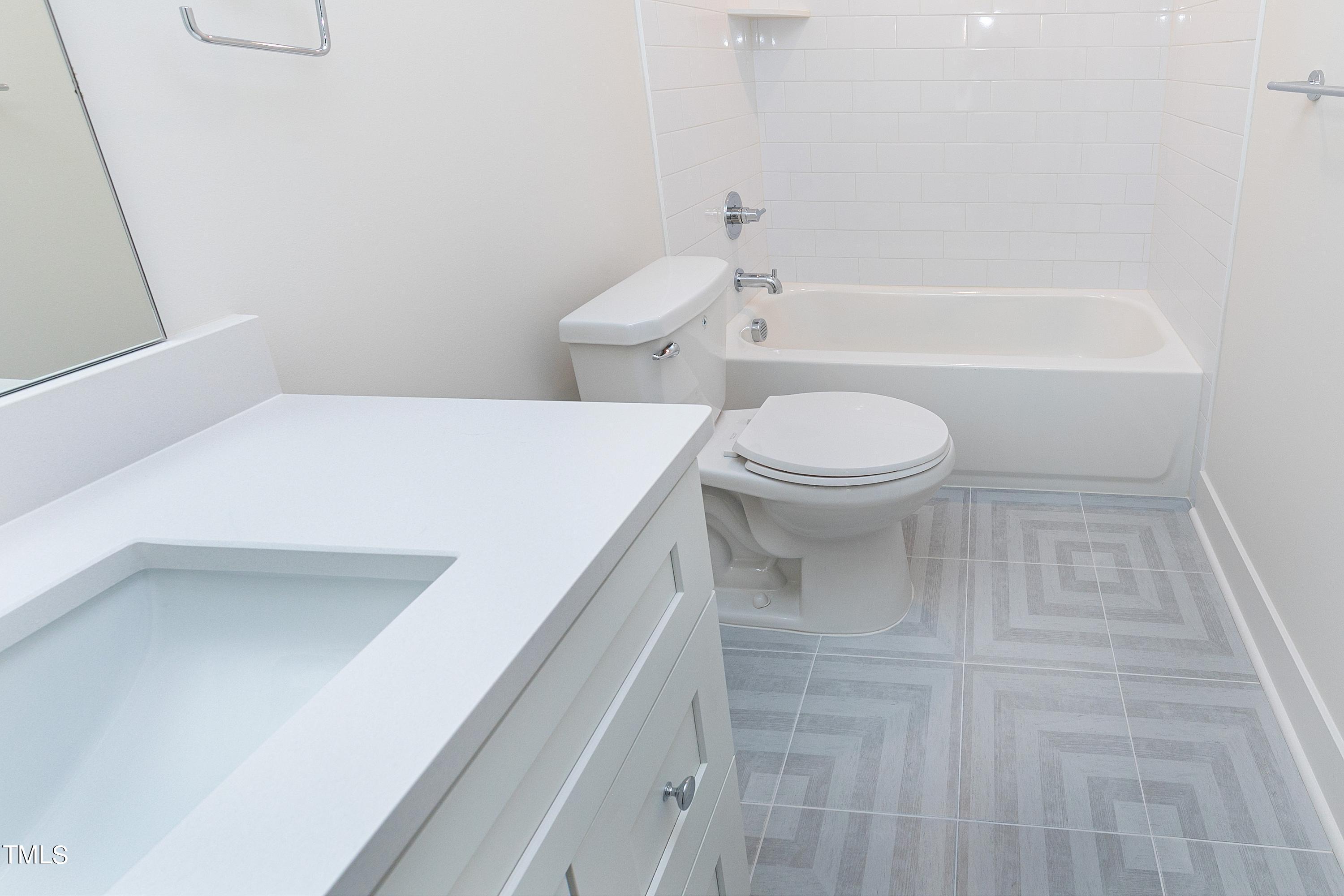 3014 Garner Road Raleigh, NC 27610 - Photo 33 of 39 a bathroom with a toilet and a bathtub