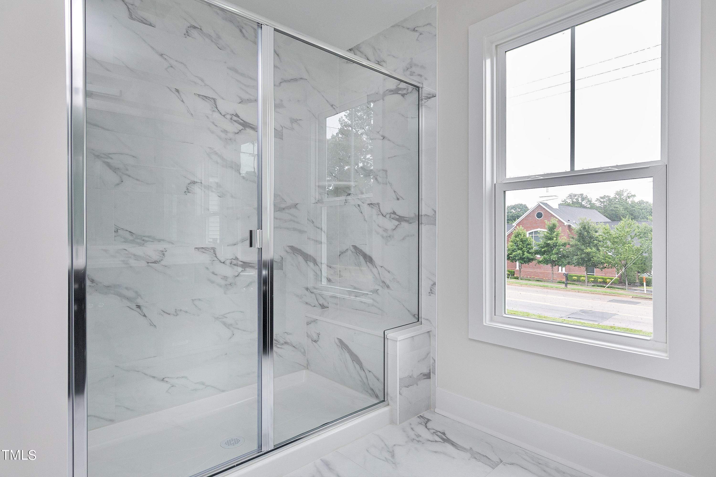 3014 Garner Road Raleigh, NC 27610 - Photo 35 of 39 a bathroom with a glass shower door