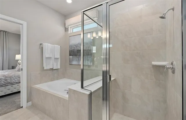 a bedroom with two beds and a window