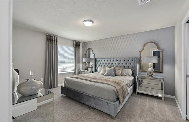 a bedroom with furniture and a fireplace