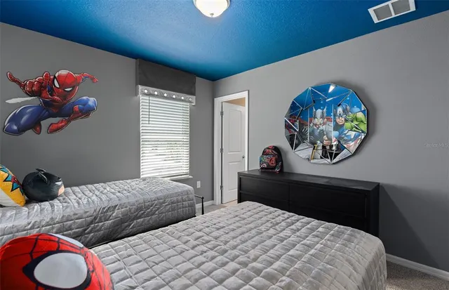 a bathroom with a toilet a sink a mirror a vanity and shower