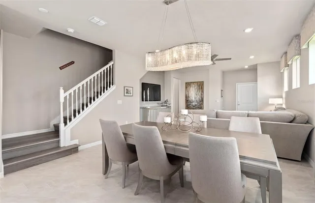 a kitchen that has a lot of cabinets a sink and appliances in it