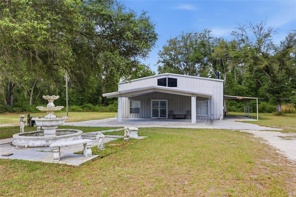 401 Southeast Falcon Road Branford, FL 32008 - Photo 64 of 76 a view of a house with pool and a yard