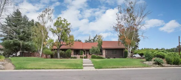 a living room with furniture with a flat screen tv