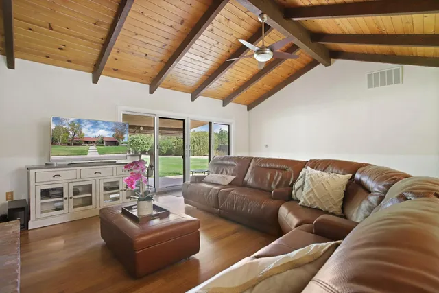 a kitchen with cabinets and chairs