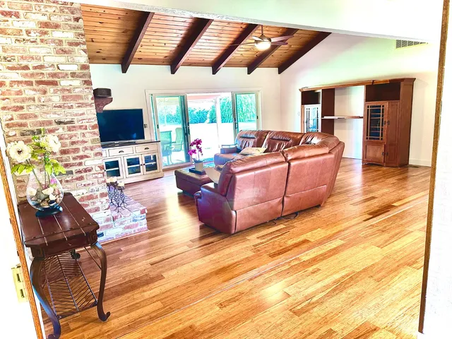 a view of a swimming pool with an outdoor space and seating area