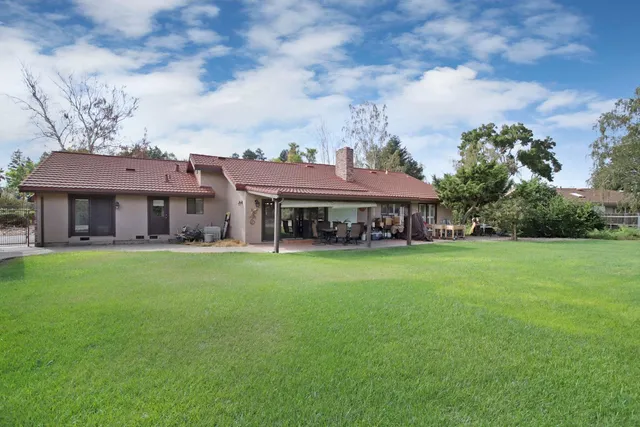 a bathroom with a window and a shower