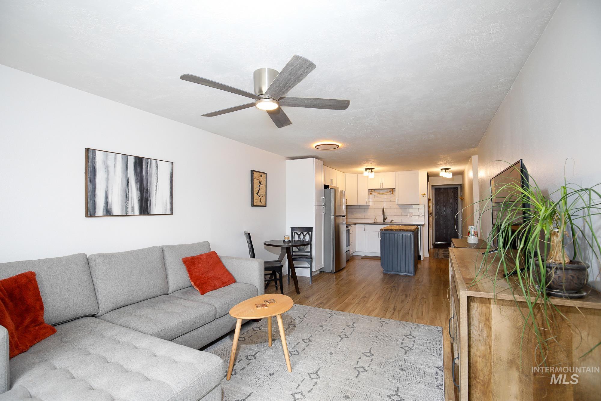 10534 West Fox Ridge Drive Boise, ID 83709 - Photo 10 of 15 Living room featuring light wood-type flooring and ceiling fan