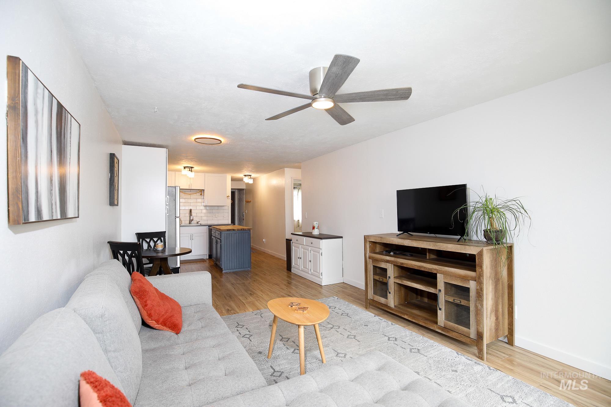 10534 West Fox Ridge Drive Boise, ID 83709 - Photo 11 of 15 Living area with light wood-style floors and ceiling fan