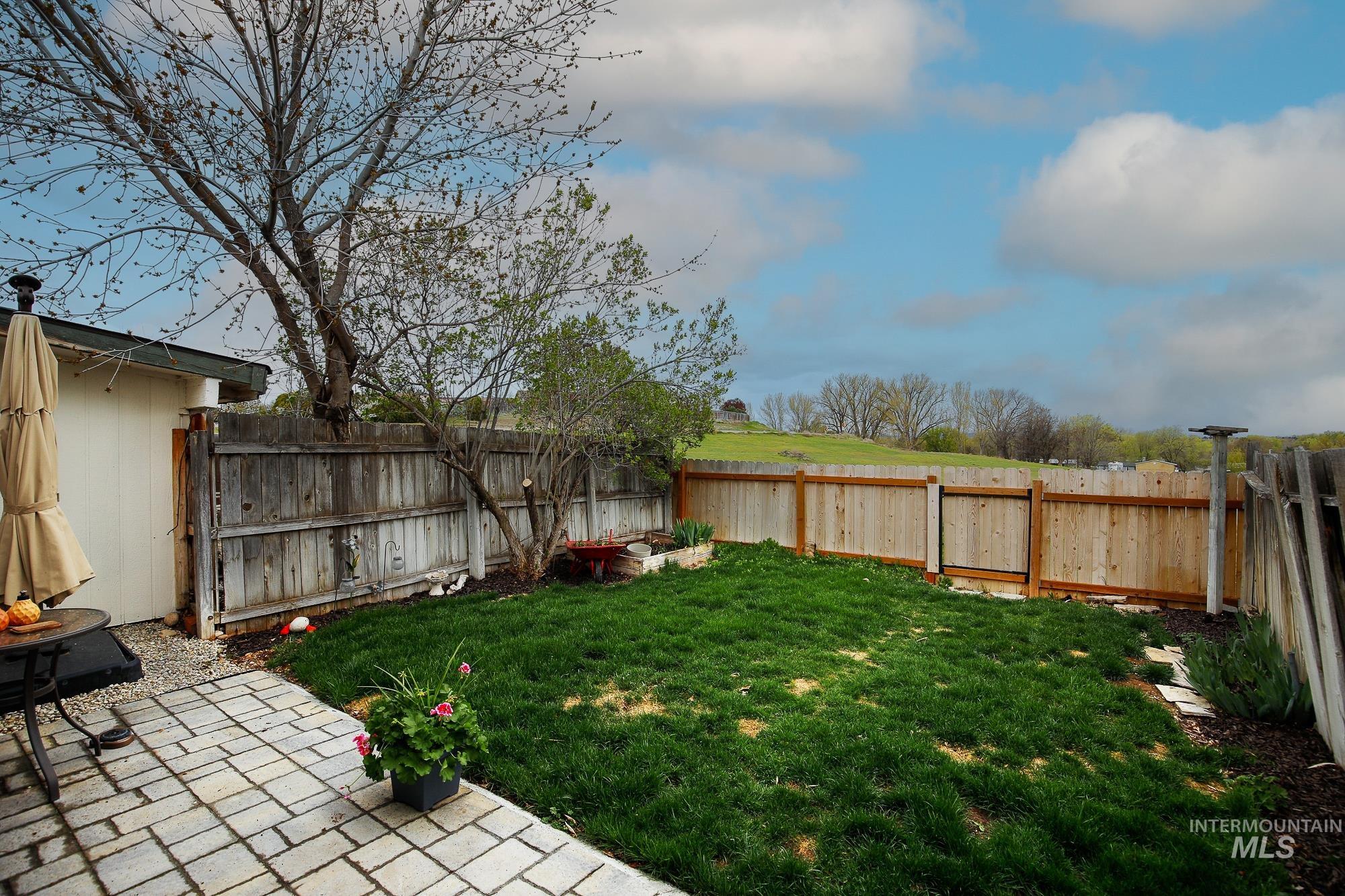 10534 West Fox Ridge Drive Boise, ID 83709 - Photo 12 of 15 Fenced backyard featuring a patio