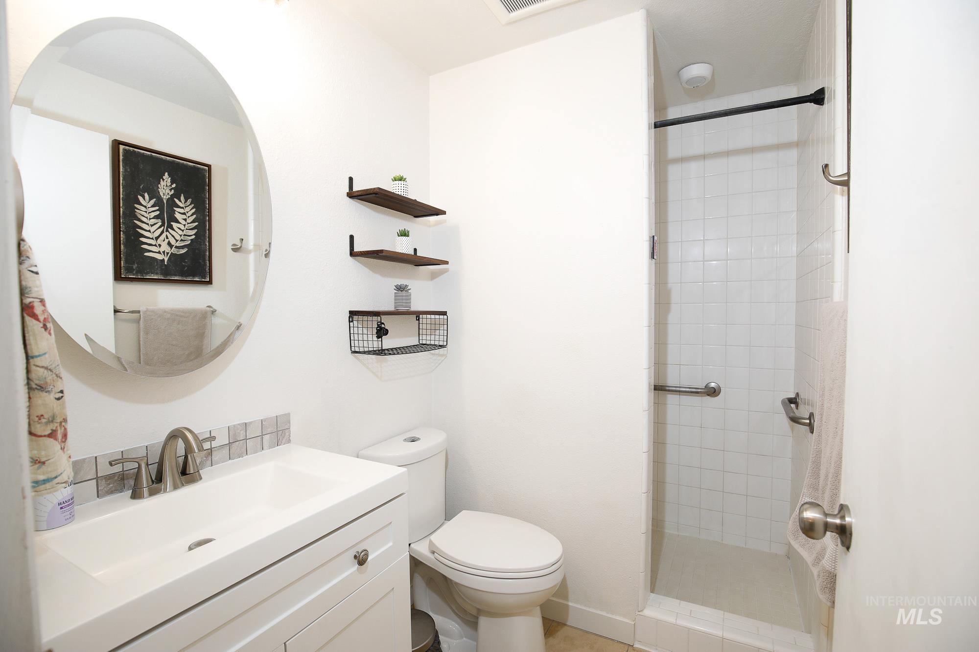 10534 West Fox Ridge Drive Boise, ID 83709 - Photo 6 of 15 Bathroom with vanity and a stall shower