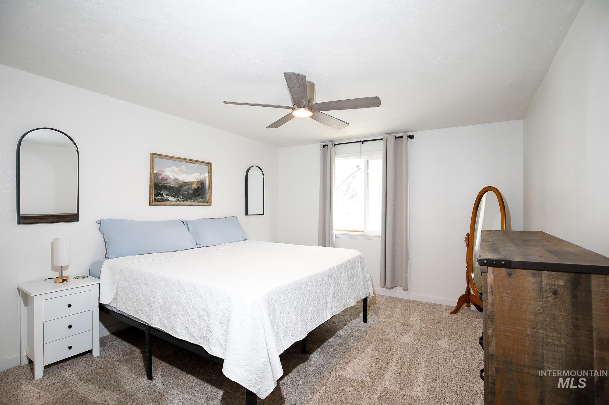 10534 West Fox Ridge Drive Boise, ID 83709 - Photo 7 of 15 Bedroom featuring carpet floors and a ceiling fan