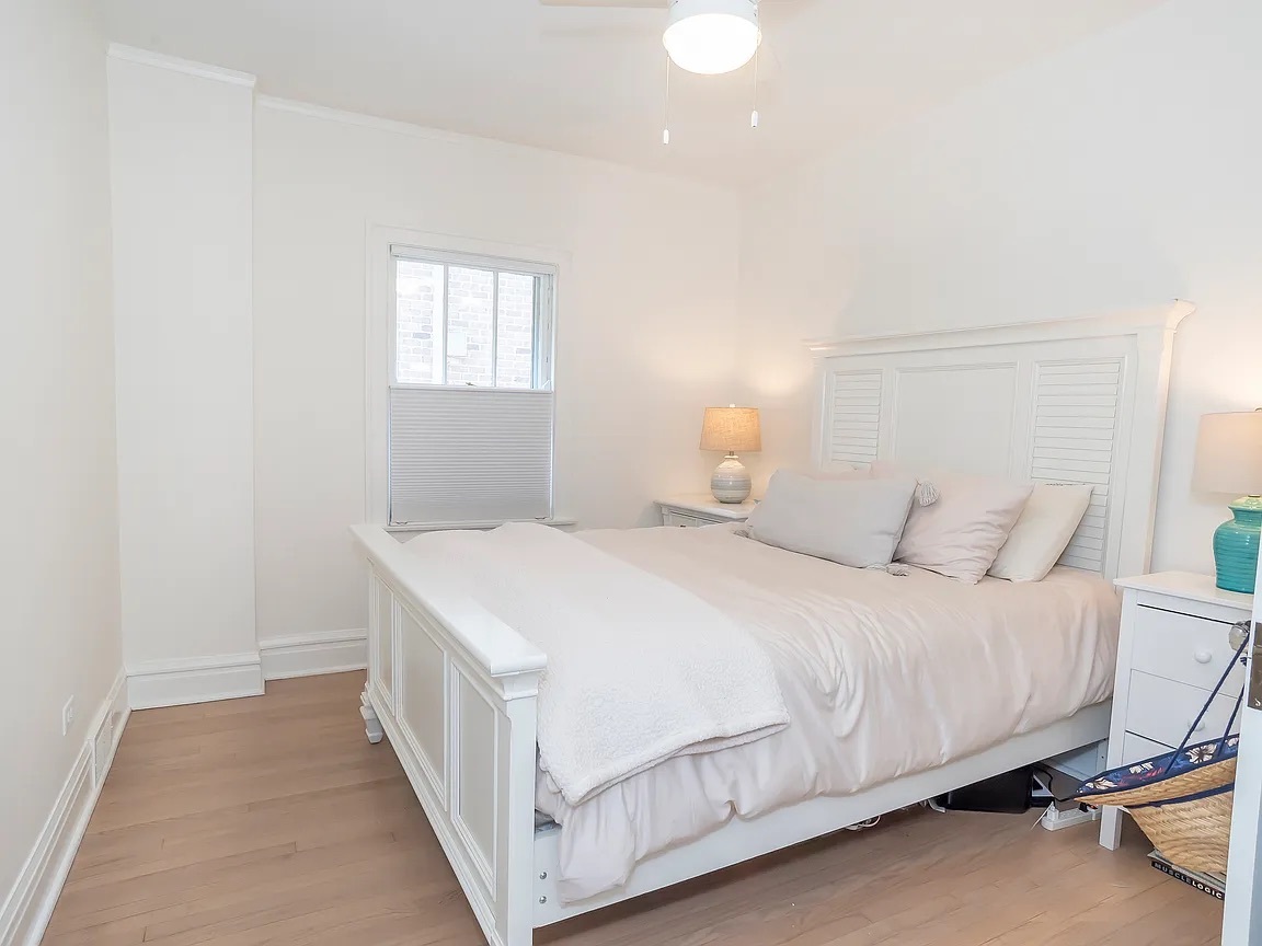 22 North Madison Avenue, Unit 2 La Grange, IL 60525 - Photo 6 of 10 a bedroom with a bed and a window