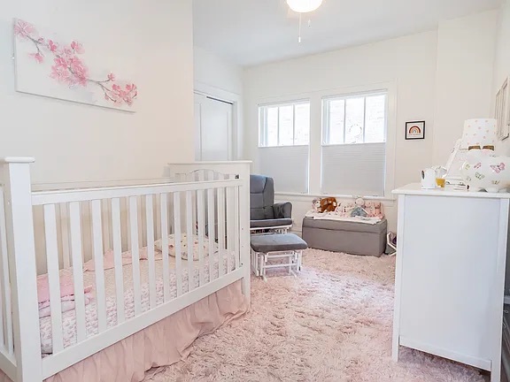 22 North Madison Avenue, Unit 2 La Grange, IL 60525 - Photo 7 of 10 a living room with furniture and a baby crib