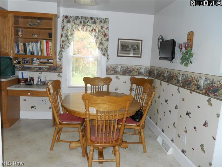 17540 Kinsman Road Middlefield, OH 44062 - Photo 6 of 16 Dining area at the end of the kitchen showing convenient desk area