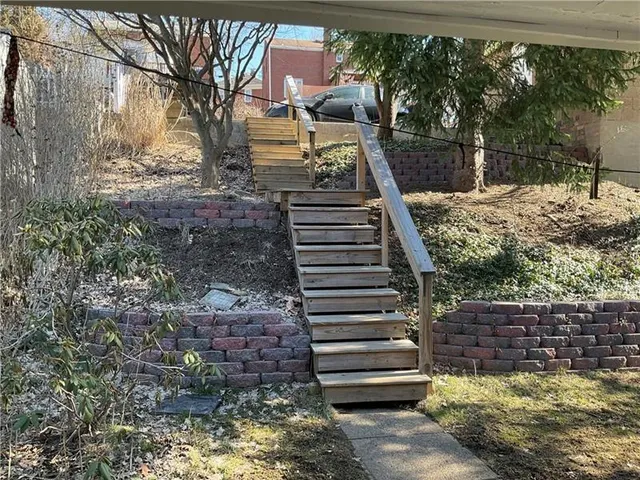 a view of a park with large trees