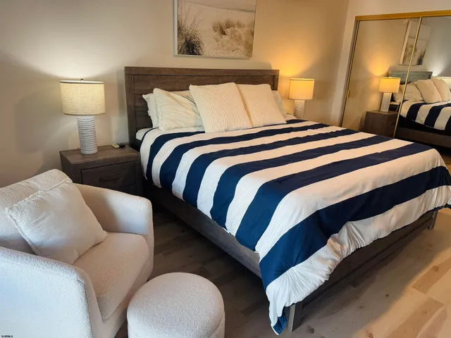 a bedroom with bed and a lamp