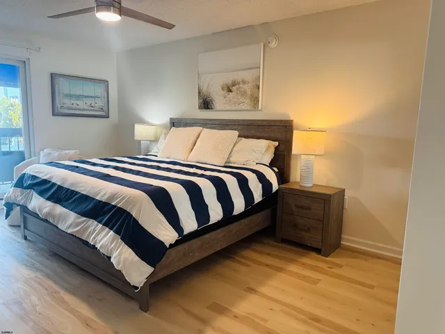 a bedroom with a bed and lamp