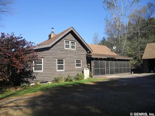 2126 Parker Road Arcadia, NY 14513 - Photo 1 of 1 Exterior Front. Side view of house with large scre