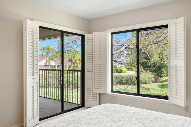 a view of a room that has a large window