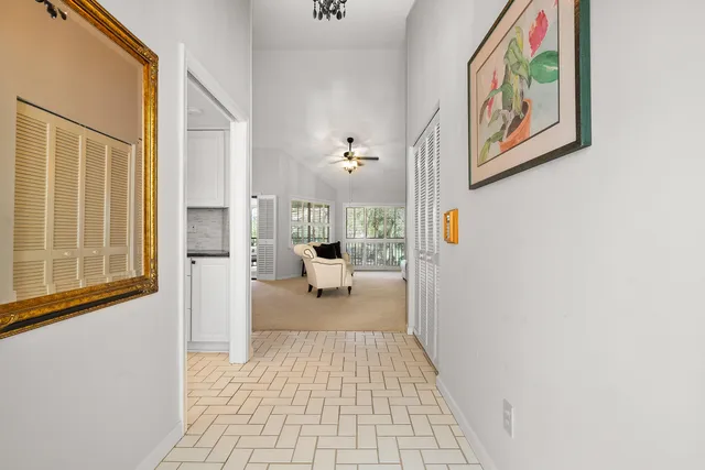 a bathroom with a toilet and a view of bedroom