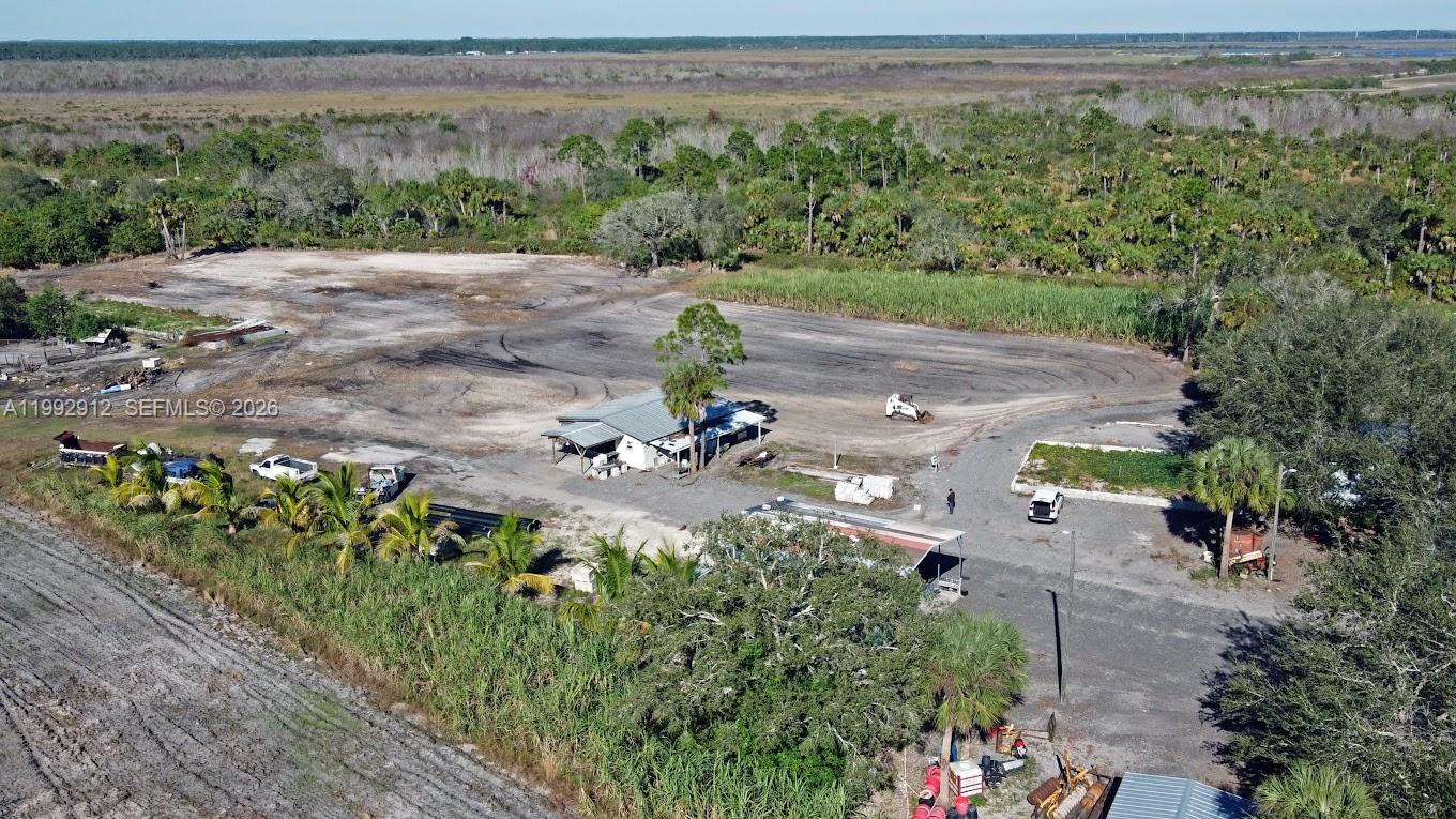 4850 Pioneer 2nd Street Clewiston, FL 33440 - Photo 29 of 34 an aerial view of a yard with a tree