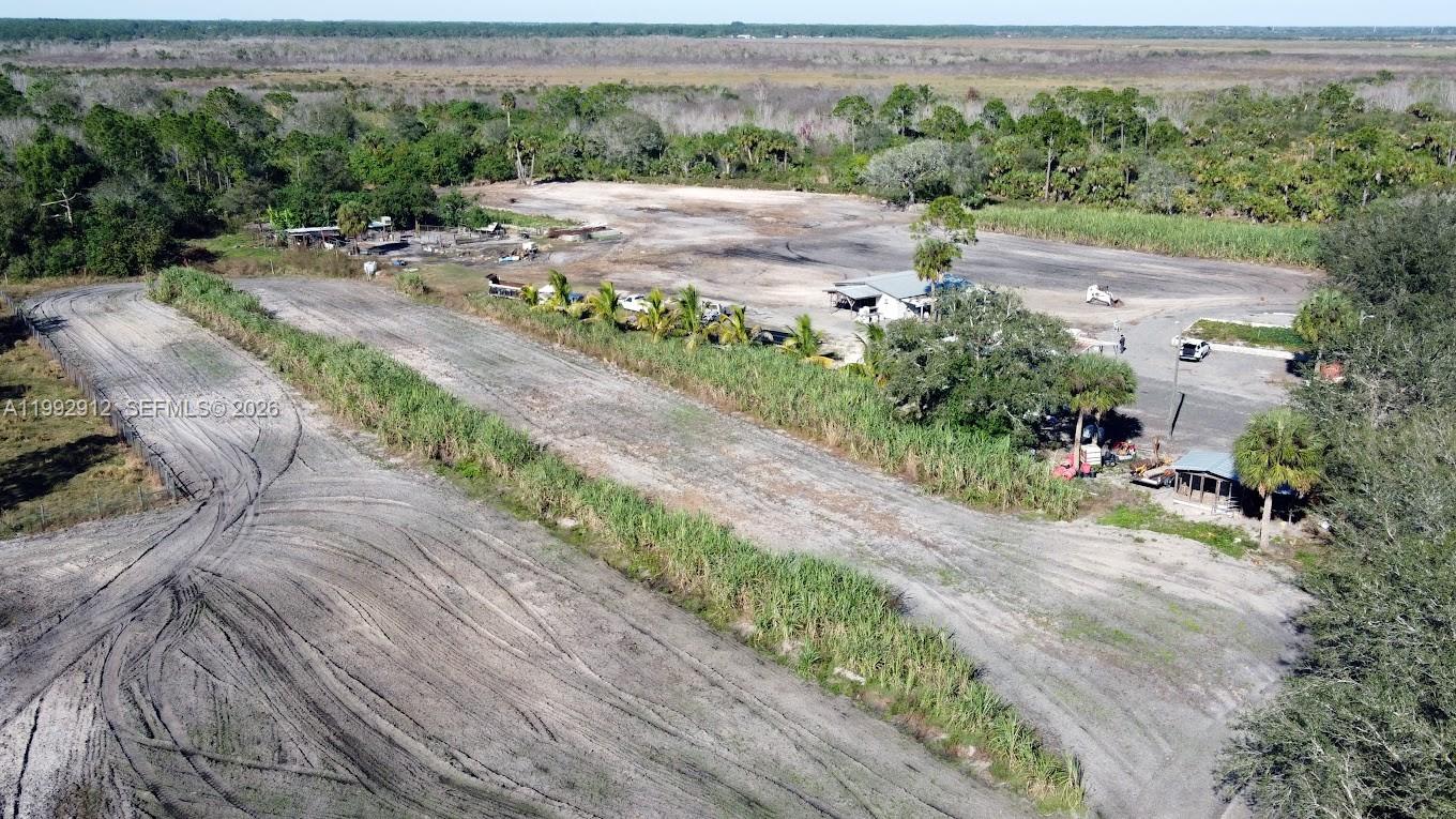 4850 Pioneer 2nd Street Clewiston, FL 33440 - Photo 30 of 34 an aerial view of a swimming pool with a yard