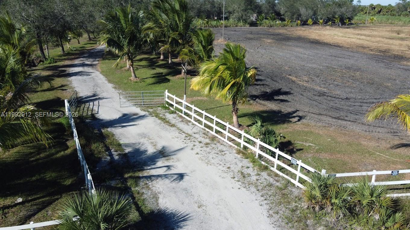 4850 Pioneer 2nd Street Clewiston, FL 33440 - Photo 3 of 34 a view of a yard with plants