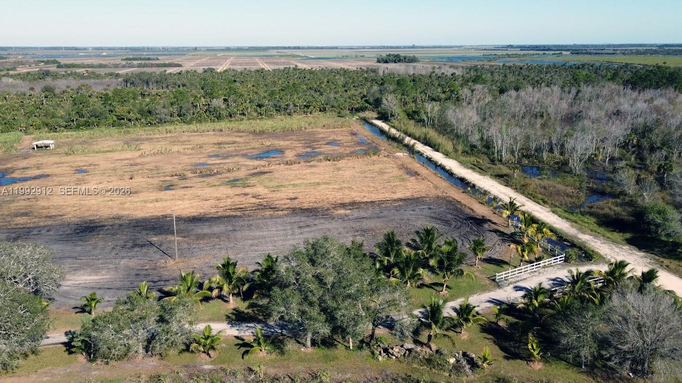 4850 Pioneer 2nd Street Clewiston, FL 33440 - Photo 4 of 34 a view of a dry yard with wooden floor and lake view