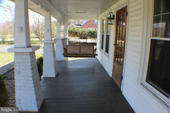 10304 Gunston Road Lorton, VA 22079 - Photo 2 of 30 a view of a hallway with wooden floor and windows