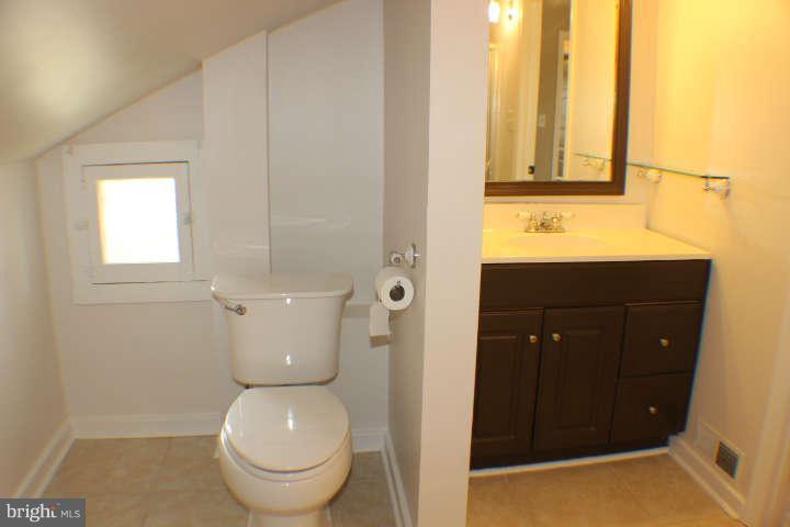 10304 Gunston Road Lorton, VA 22079 - Photo 23 of 30 a bathroom with a toilet and a sink