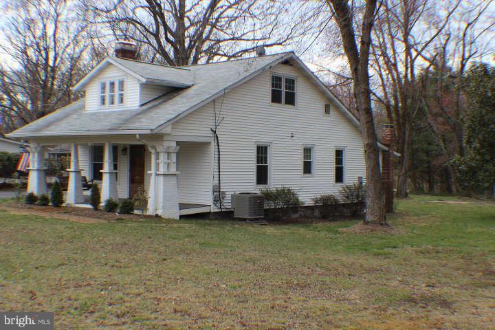 10304 Gunston Road Lorton, VA 22079 - Photo 26 of 30 a front view of a house with a yard