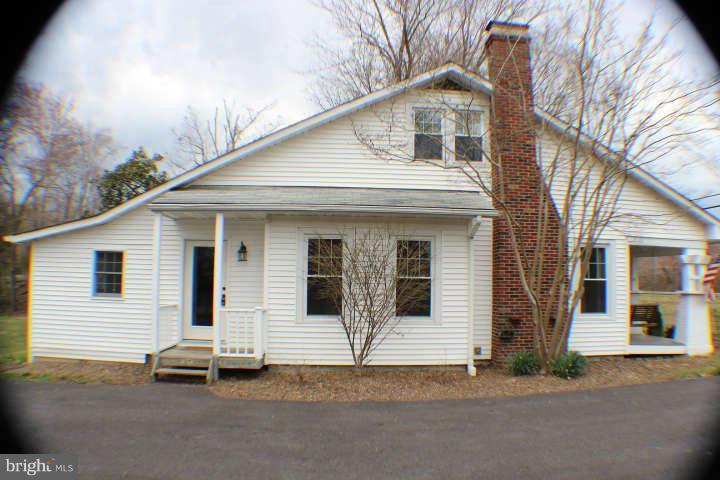 10304 Gunston Road Lorton, VA 22079 - Photo 27 of 30 a front view of a house with a road