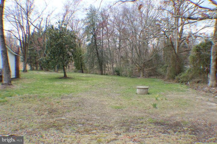 10304 Gunston Road Lorton, VA 22079 - Photo 28 of 30 a view of a field with trees in the background