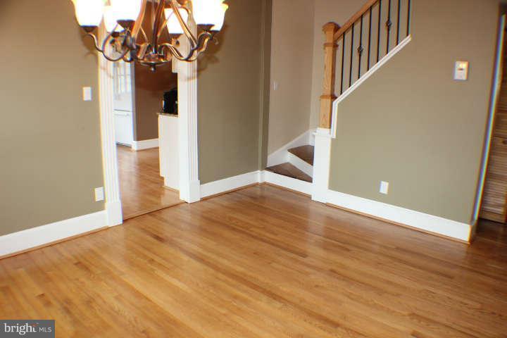 10304 Gunston Road Lorton, VA 22079 - Photo 7 of 30 a view of an empty room with wooden floor