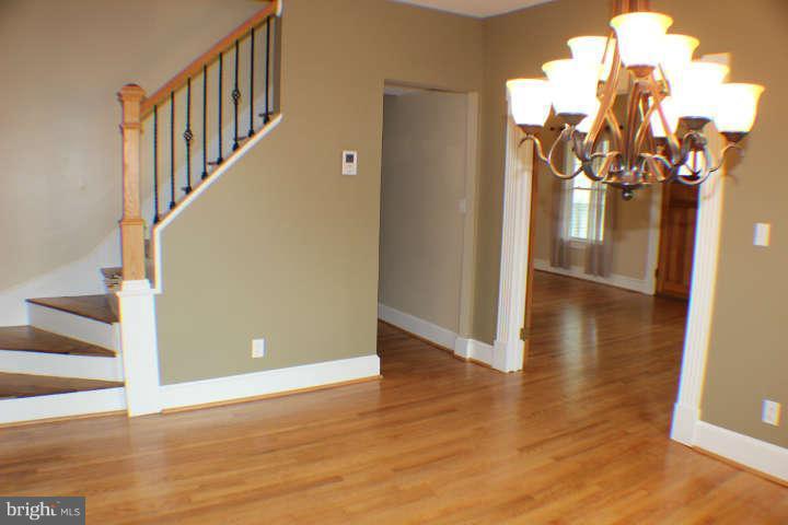 10304 Gunston Road Lorton, VA 22079 - Photo 8 of 30 a view of a livingroom with wooden floor