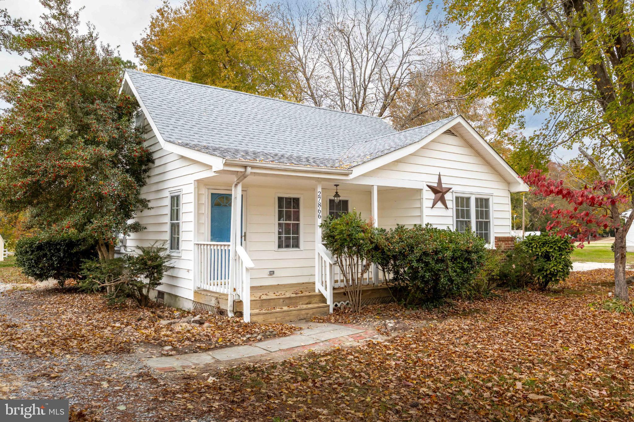 28766 Larry Lankford Road Princess Anne, MD 21853 - Photo 1 of 38 a front view of a house with garden