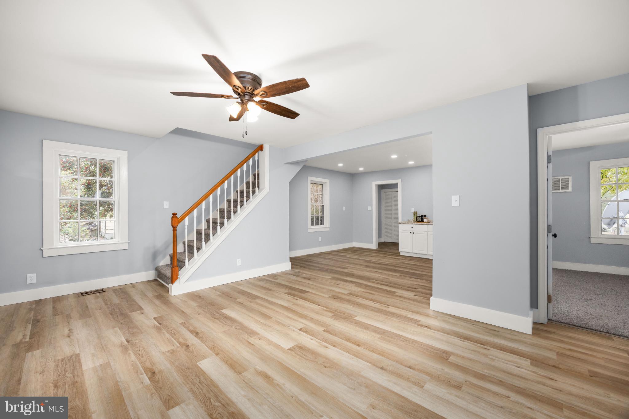 28766 Larry Lankford Road Princess Anne, MD 21853 - Photo 13 of 38 a view of empty room with wooden floor and fan