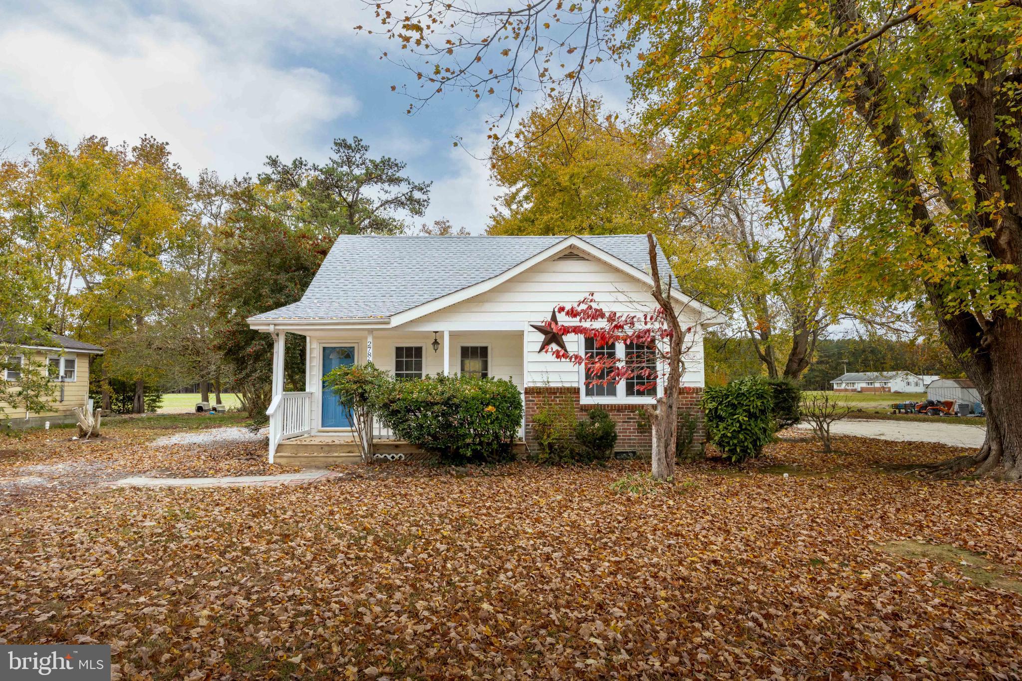 28766 Larry Lankford Road Princess Anne, MD 21853 - Photo 2 of 38 a front view of a house with garden
