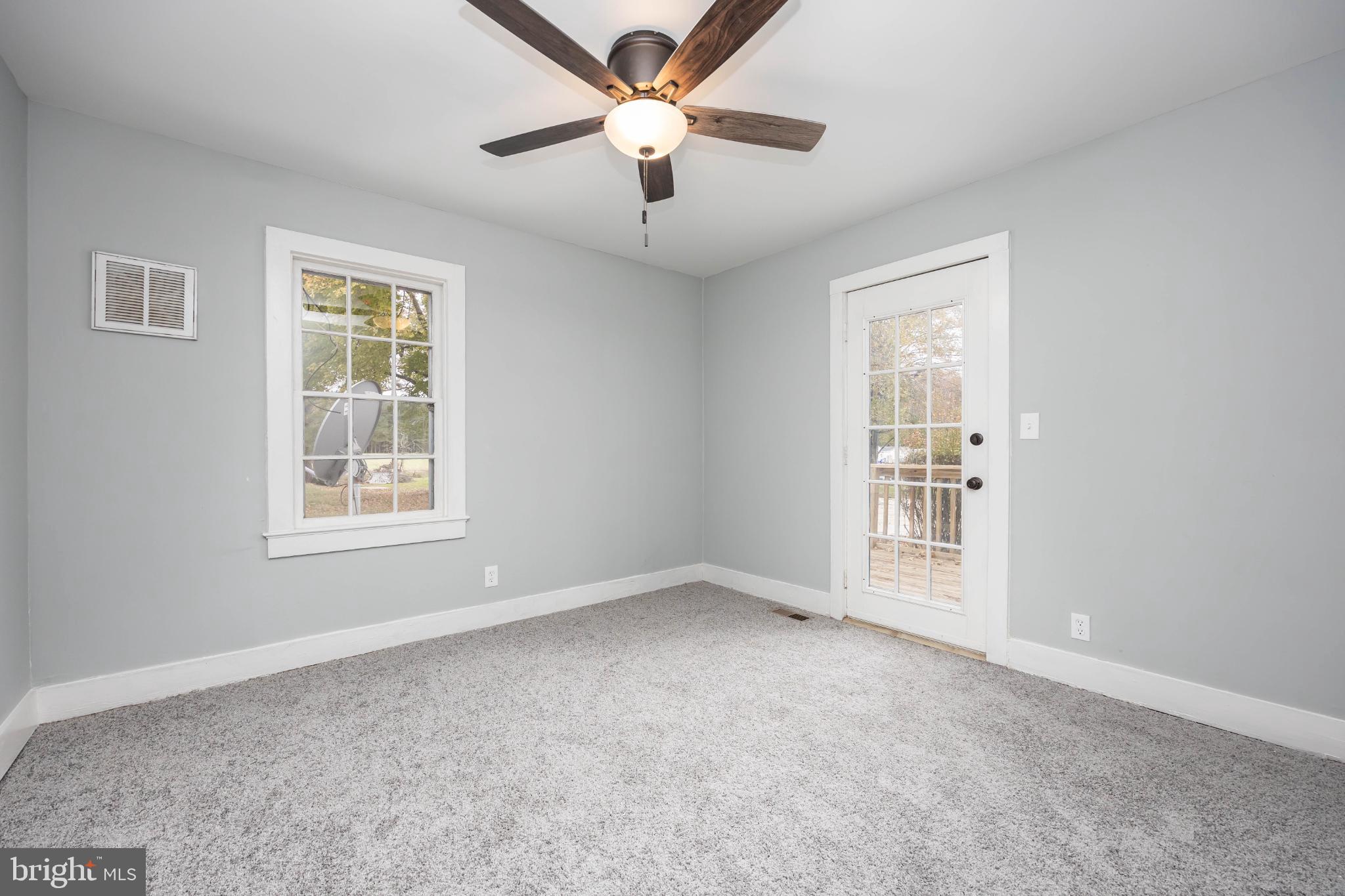 28766 Larry Lankford Road Princess Anne, MD 21853 - Photo 22 of 38 a view of an empty room with a window
