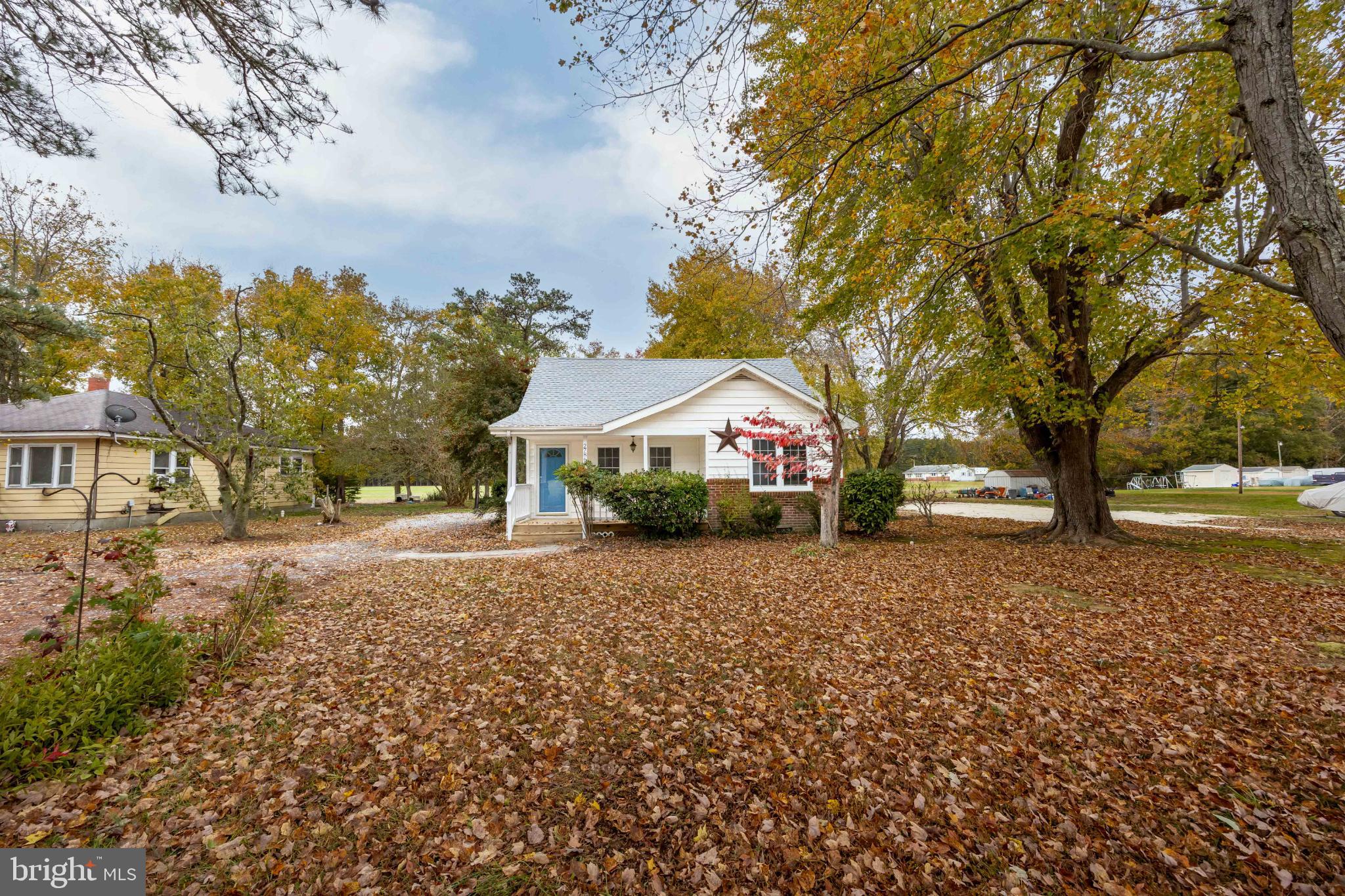28766 Larry Lankford Road Princess Anne, MD 21853 - Photo 31 of 38 a front view of a house with a yard and garage